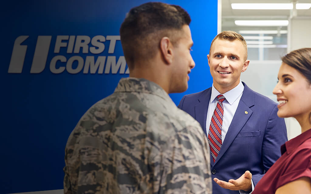 A young military couple meeting at First Command to discuss the benefits of a financial advisor.