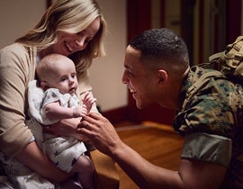 Military couple spending time with their new baby.