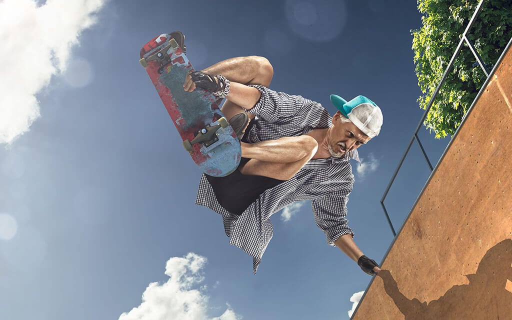 senior citizen on skateboard