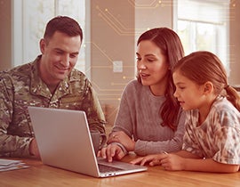 Military family looking at a computer screen.
