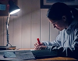 Woman studying at her desk