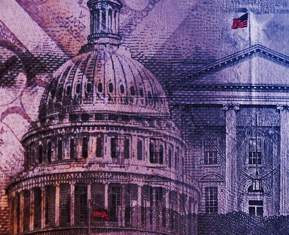 The Capital Building beside the White House with a fifty dollar bill overlay.