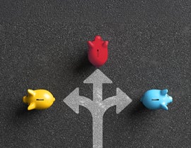 Three piggy banks surrounding a directional arrow