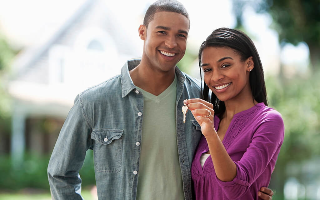 Couple holding keys