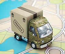 A toy camouflaged military moving truck to represent PCS moving per diems.
