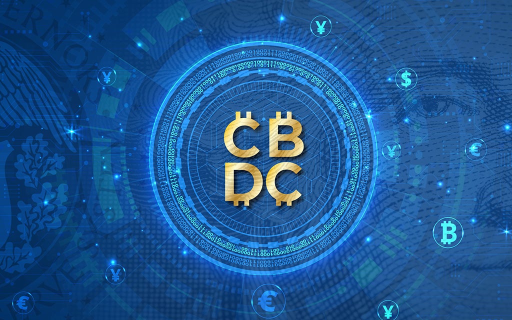 CBDC in gold letters with a blue digital circle background over the us dollar