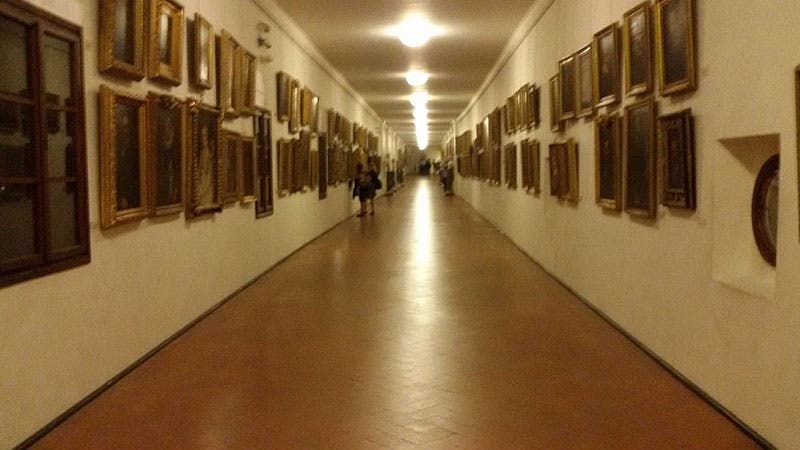 An older view of the interior of the Vasari corridor along the Uffizi, filled with artists’ self-portrait (Wikimedia commons)