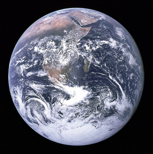 The “Blue Marble” photograph of the Earth, taken in 1972, that shows atmospheric patterns caused by Coriolis forces (Wikimedia commons)