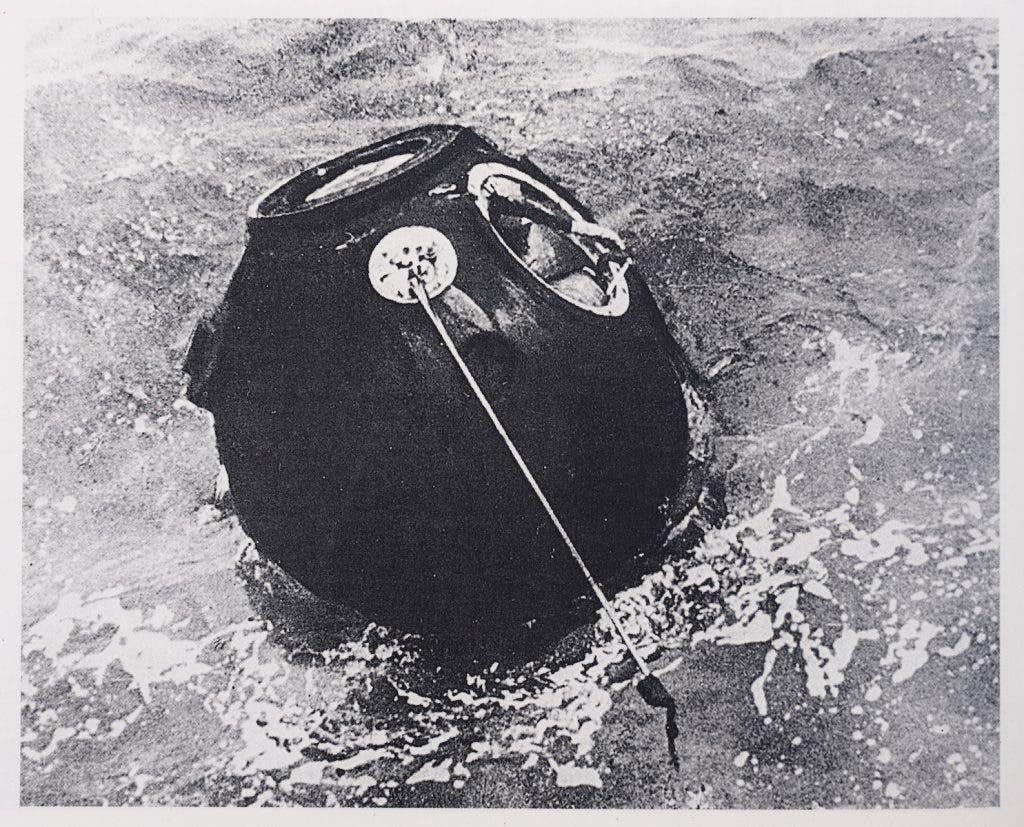 The Zond 5 capsule in the Indian Ocean after splashdown. The spacecraft’s closest approach to the Moon was approximately 1,200 miles during its circumlunar flight. Image source: Clark, Phillip. The Soviet Manned Space Program: An Illustrated History of the Men, The Missions, and the Spacecraft. Orion, 1988. View Source

