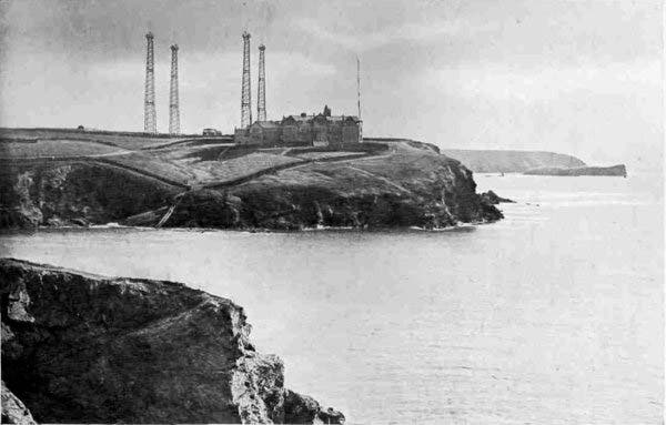 The Marconi station on Poldhu Point, Cornwall, photograph, 1910; the fixed antennas were not in place on Dec. 12, 1901, but the station was, transmitting three-dot pulses across the Atlantic, which Marconi claims to have received in St. John’s, Newfoundland (Wikimedia commons)
