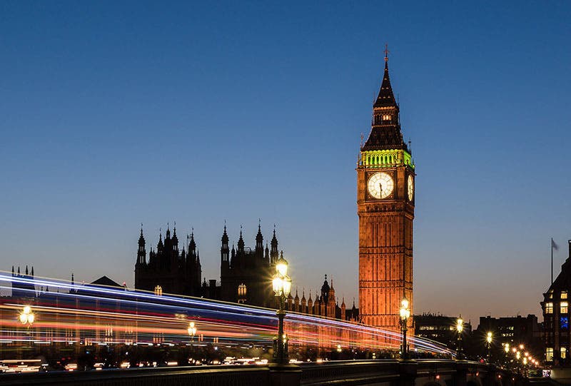 Elizabeth Tower, its clock, and the Palace of Westminster at sunset, recent photograph (Wikimedia commons)