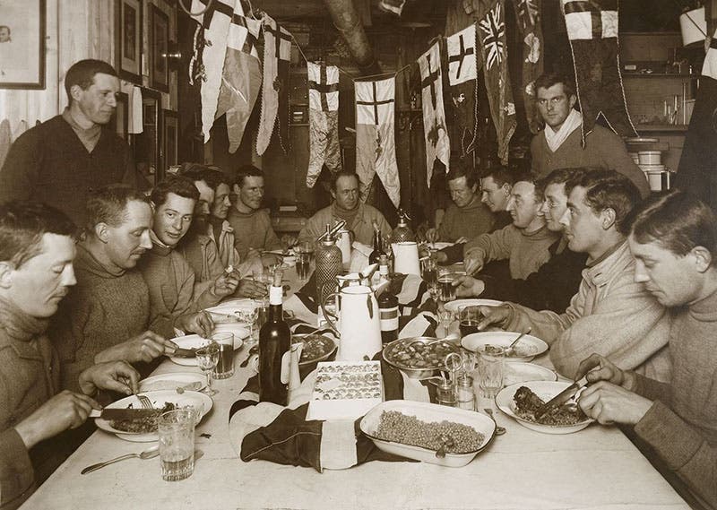 Birthday dinner for Robert Scott, June 6, 1911, as it turned out, his 43rd and last; at base camp, photograph by Herbert Ponting, Royal Collection, Windsor (rct.uk)