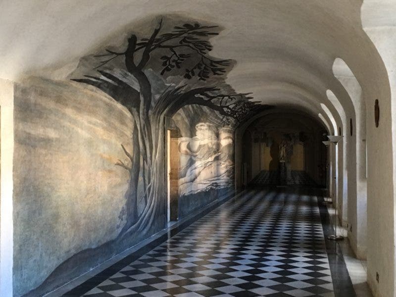 Saint Francis of Paola, anamorphic fresco painting by Emmanuel Maignan, viewed from the end of the convent hallway, Ss. Trinità dei Monte, Rome (trinitadeimonti.net)