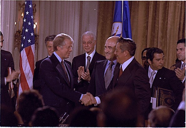 President Jimmy Carter and General Omar Torrijos sign two treaties that will require the U.S. to relinquish ownership of the Canal to Panama at noon on December 31, 1999, but give the U.S. the right to use military force to defend the neutrality of the Canal.