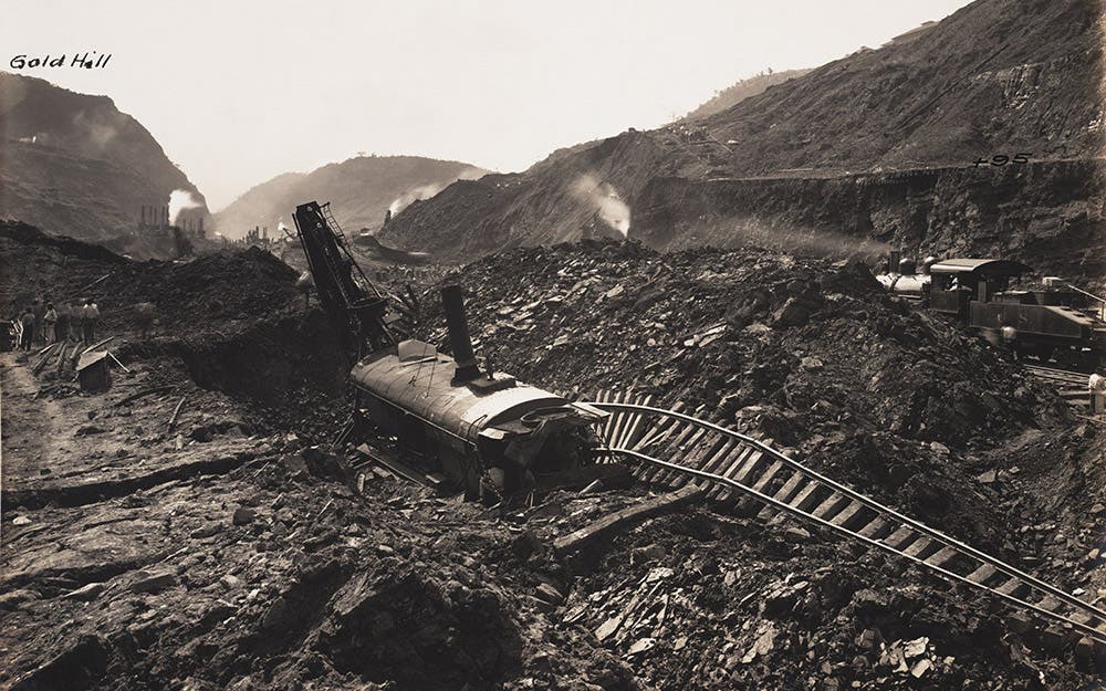 Steam shovel #201 sits amidst upheaved material, February 6, 1913.
 Pressure on the sides of the Canal could cause material to push up from below and “swallow” equipment. Gaillard described standing on ground in the Cut that rose six feet in five minutes with a smooth almost imperceptible motion.  View in Digital Collection »