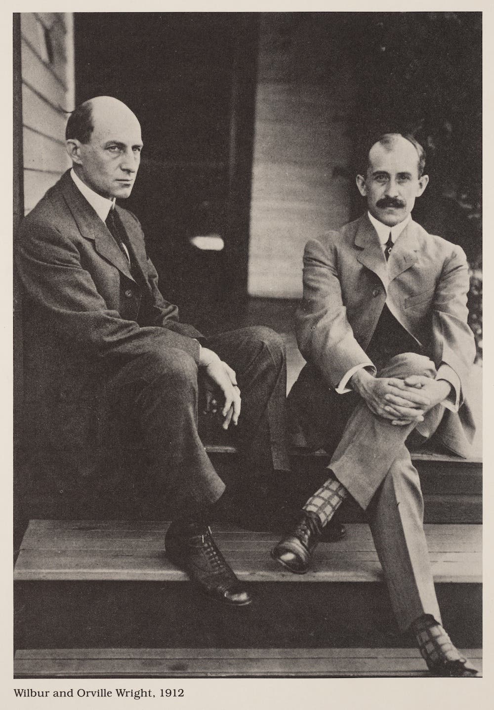 Wilbur (left) and Orville Wright at home in Dayton, Ohio, ca. 1910. Hallion, Richard P., ed. The Wright Brothers: Heirs of Prometheus. Smithsonian Institution, 1978. View Source.