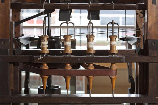 Detail of a replica of Richard Arkwright’s water frame, showing the spinners that wind the spools, in the Science and Industry Museum, Manchester (scienceandindustrymuseum.org)