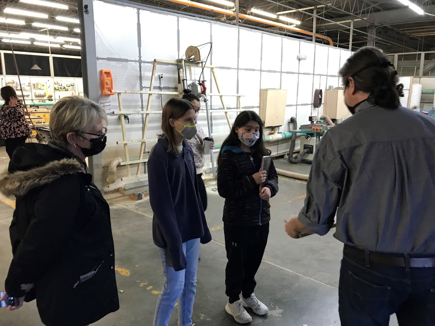 Teacher Peggy Kelly and students touring Hammerspace.