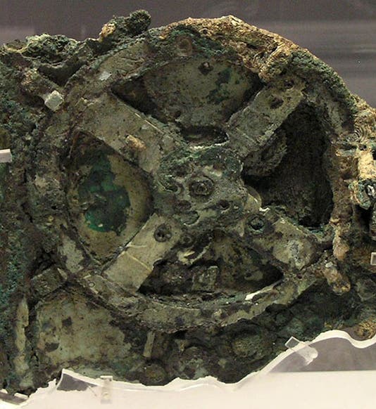 Front of Fragment A of the Antikythera Mechanism, showing the main four-spoked gear wheel, b1, National Archaeological Museum of Athens (Wikimedia commons)