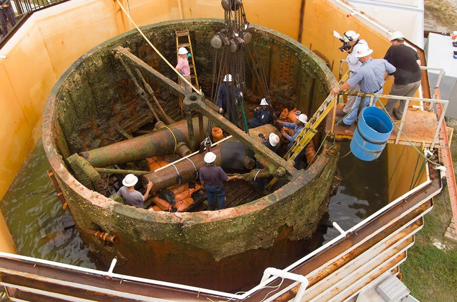 The turret of the USS Monitor, recovered from its watery grave and photographed in 2004 by the staff of The Mariners' Museum and Park, as the two large 11-inch Dahlgren cannons were being removed (The Mariners' Museum and Park)