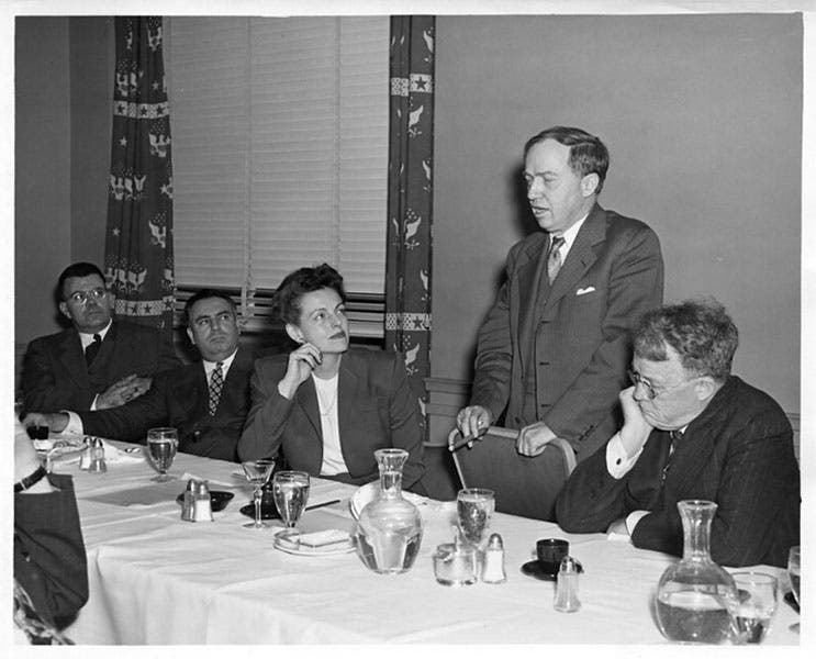Group portrait, photograph, Edward Condon at far left, with Harlow Shapley speaking, 1945 (Smithsonian Institution on flickr.com)