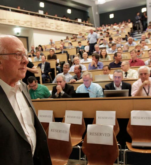 Peter Higgs entering the large seminar room at CERN, 2012, photograph, Washington Post (washingtonpost.com)