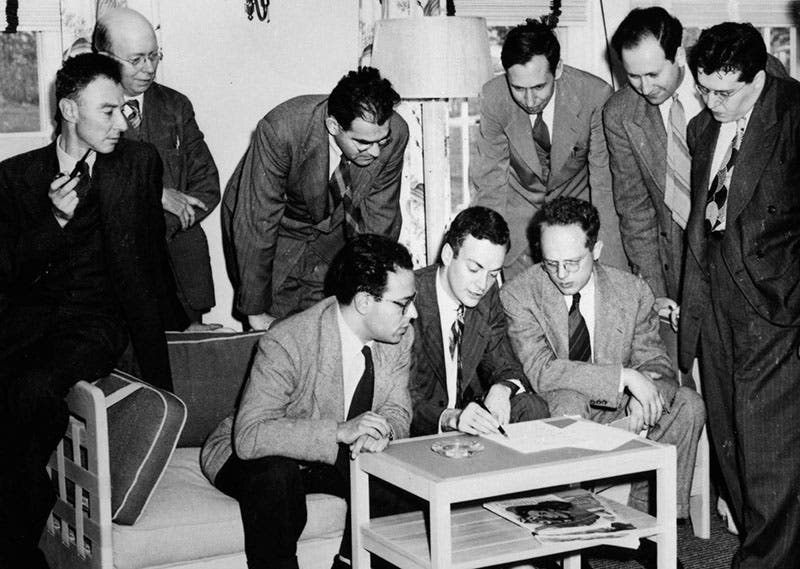 Group photo of the Shelter Island Conference of 1947, with Abraham Pais on the couch, just to the left of the scribbling Richard Feynman, with Robert Oppenheimer on the arm of the couch at left (nasaonline.org)