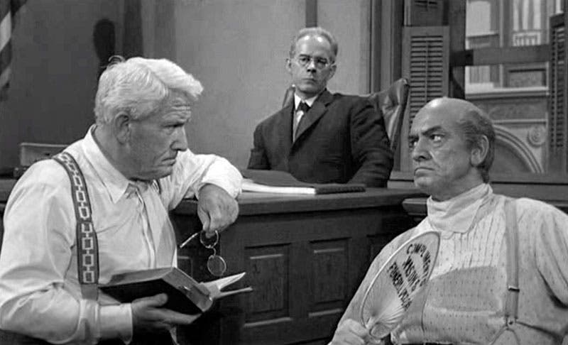 Still from the original film version of Inherit the Wind (1960), with Spencer Tracy as Clarence Darrow (left), Fredric March as William Jennings Bryan (right), and Harry Morgan as Judge Raulston (Wikimedia commons)