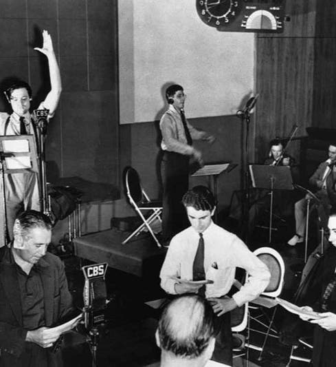 Orson Welles and the rest of the cast of the Mercury Theater on the Air, rehearsing for the Oct. 30, 1938 broadcast of “War of the Worlds” (historyrevealed.com)