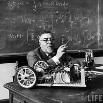 Norbert Wiener in the MIT classroom with his tricycle cart, which he built (with J. Wiesner) with two feedback systems, for demonstration purposes; it was supposed to behave like a “moth” or a “bedbug,” photo from Life Magazine (monoskop.org)