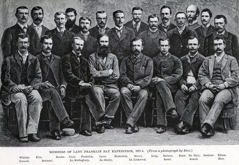 Group photo of the crew of the Greely expedition of 1881-84, taken by George W. Rice, front row, far right; Greely is in center front, with long beard; NOAA, 1881 (Wikipedia)