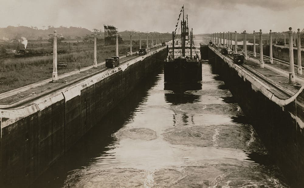 S.S. Ancon in lower Gatun locks, beginning the first official transit of the Canal.
Building the three sets of locks at Gatun required more than 2,000,000 cubic yards of concrete. Each of the chambers is 110 feet wide by 1,000 feet long, with dividing walls 60 feet wide and floors up to 20 feet thick.  View in Digital Collection »