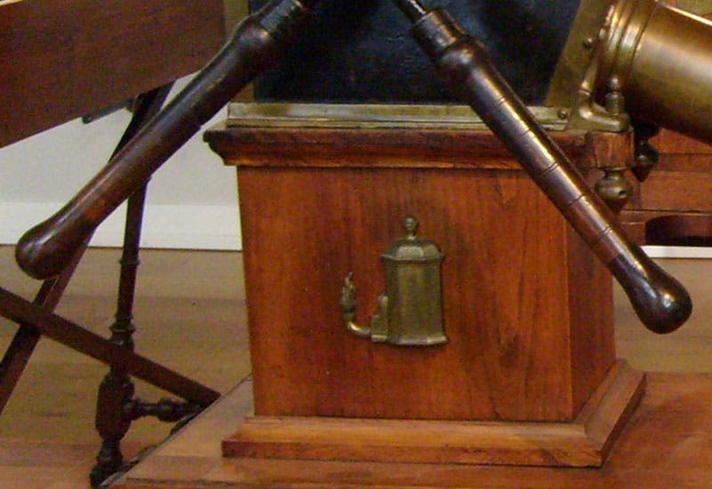 The “Oriental Lamp,” the emblematic device of the Musschenbroek workshop, as mounted on the enclosure of the 1698 pump in Groningen (detail of sixth image) (Wikimedia commons)
