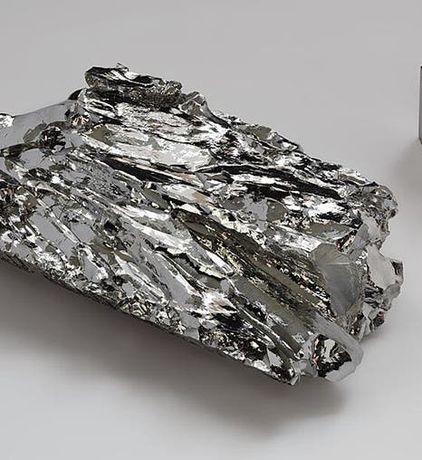 Molybdenum crystalline fragment and cube, an element first isolated by Peter Jacob Hjelm in 1781 (Wikimedia commons)