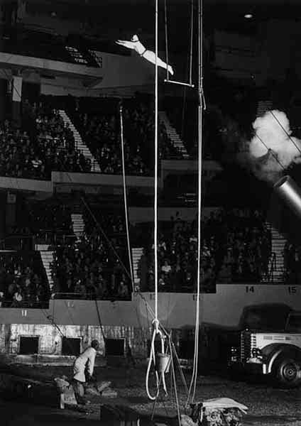 A circus performer just shot from a cannon, headed for a net 75 feet away, 1940 (edgerton-digital-collections.org at MIT)