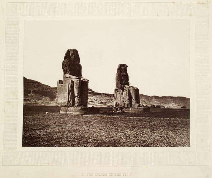 The Colossi of Memnon on the plains of Thebes, the uncropped photograph by William de Wiveleslie Abney, in his Thebes and its Five Greater Temples, page 2r, 1876, University Library, Heidelberg (digi.ub.uni-heidelberg.de)