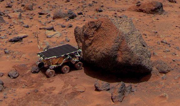 The Martian rover Sojourner examining a boulder nicknamed Yogi, photo by Pathfinder, 1997 (apod.nasa.gov)
