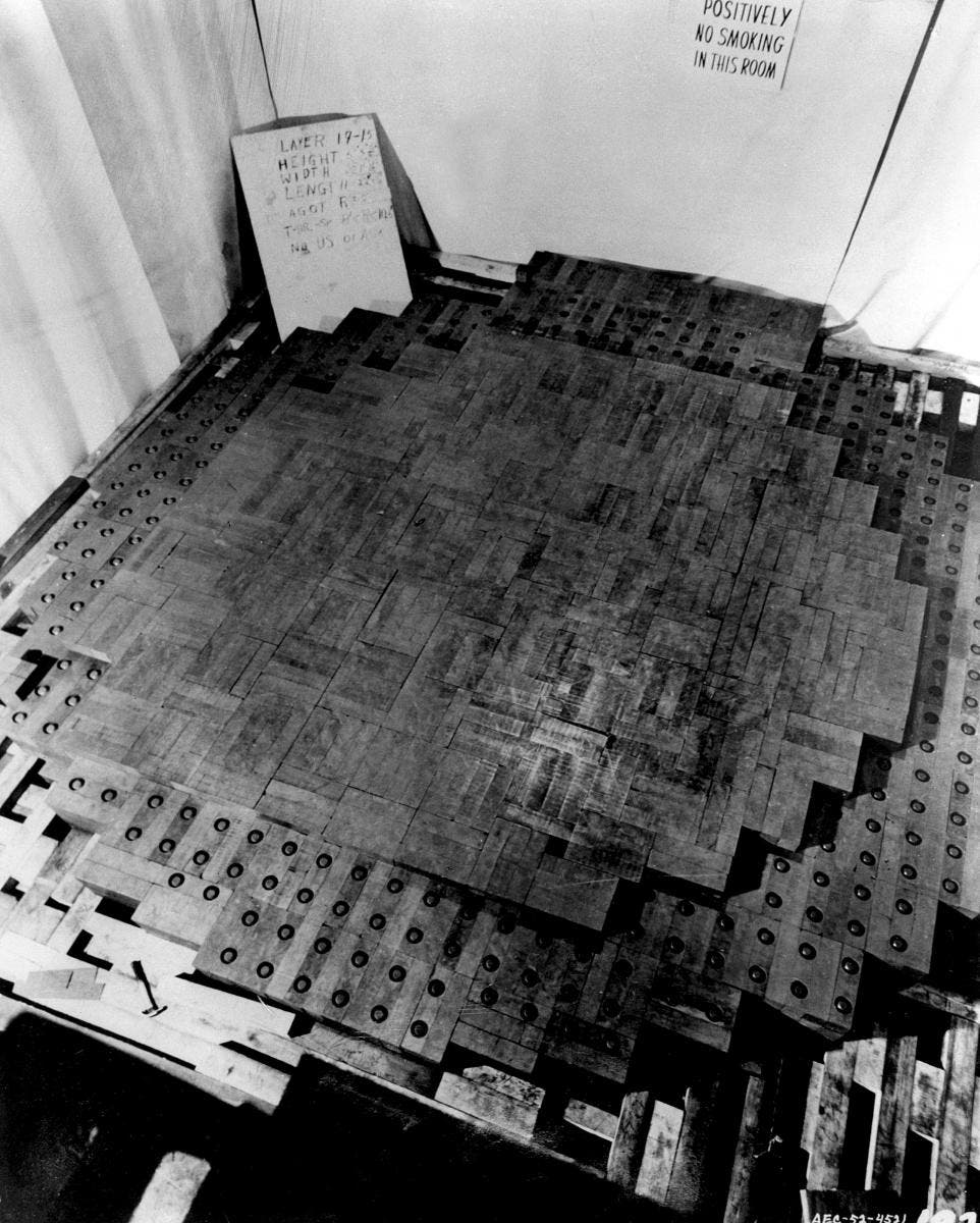 Several of the 57 layers of graphite bricks that made up CP-1; the lower layer contains uranium pellets in holes bored in the bricks; this is presumably a reconstruction of the pile, as no photographs were taken of CP-1 in 1942; photograph, Atomic Heritage Foundation (atomicheritage.org)