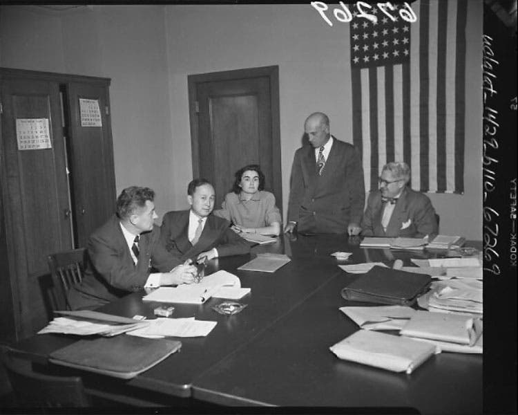 Hsue-Shen Tsien at his deportation hearing, 1950, looking none too pleased, after which, ironically, he was prevented from leaving the country until 1955, photograph, 1950, UCLA library (digital.library.ucla.edu)