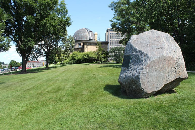 Chamberlin Rock (with Washburn Observatory in the background), Observatory Hill, University of Wisconsin, Madison; rock was moved off-campus in 2021 (wisconsinhistoricalmarkers.com)