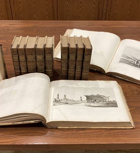 All 12 volumes of Histoire scientifique et militaire de l'expédition française en Egypte, by Louis Reybaud, 1830-36, including 10 octavo text vols, and two oblong quarto atlases; the opened text volume at left shows the portrait of André Detertre, who did all of the 160 portraits in the 10 volumes (Linda Hall Library copy)