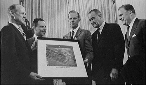 William H. Pickering (left) presents a print of Photo 11 of the Martian surface, taken by Mariner 4, to President Lyndon Johnson (Wikimedia commons)