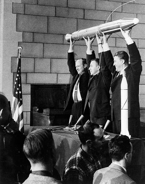 William H. Pickering (holding a replica of Explorer 1 at left) celebrates the success of the mission, Feb. 1, 1958, with James Van Allen at replica center and Wernher von Braun at replica right (Wikimedia commons)