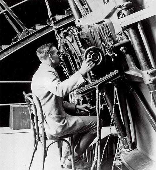 Milton Humason at the eyepiece of the 100” Hooker telescope at Mt. Wilson Observatory, 1922 (reddit.com)