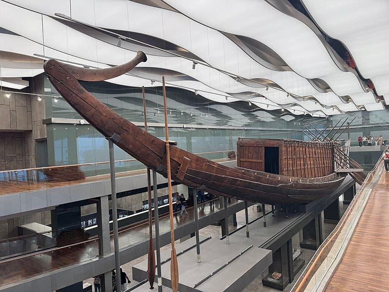 View of Khufu’s solar boat from the stern, Grand Egyptian Museum, Giza, photograph, 2026 (Wikimedia commons)