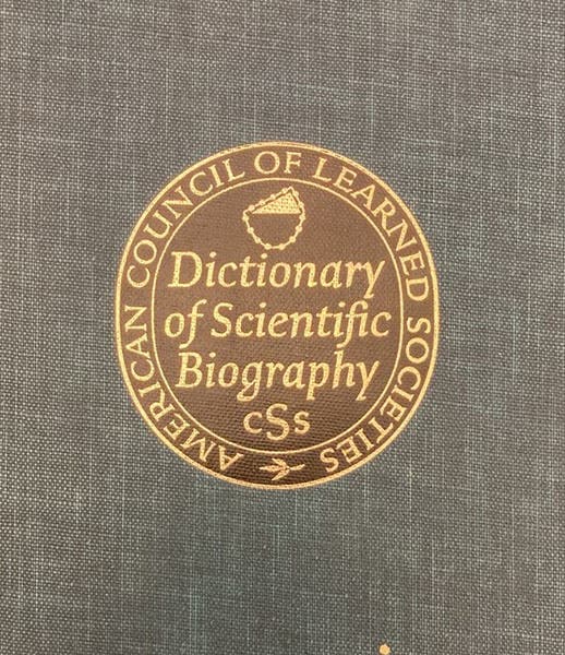 Detail of front cover, Dictionary of Scientific Biography, vol. 1, with embossed wreath of spheres device (Linda Hall Library)