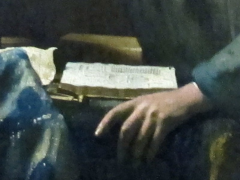 Detail of The Astronomer, 1668, showing the opened book on the table, which has been identified as a book by Metius (made from a file on Wikimedia commons)