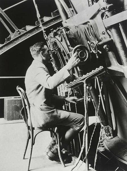 Edwin Hubble at the eyepiece of the 100-inch Hooker reflecting telescope, Mount Wilson Observatory, photograph, 1922 (media.npr.org)