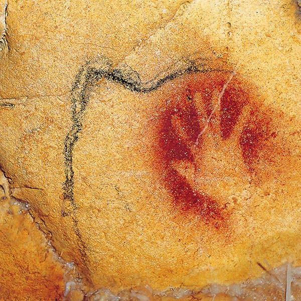 Negative handprint, perhaps by one of the artists, Chauvet Cave, Ardeche, France (donsmaps.com)
