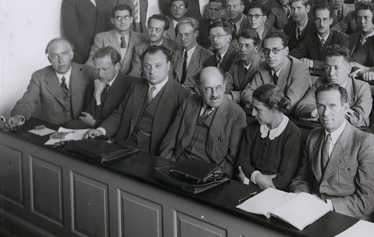 Participants at a conference in Copenhagen in 1937; Niels Bohr is in the front row, far left, next to Werner Heisenberg and Wolfgang Pauli. Lise Meitner is the sole woman in the photograph (Wikimedia commons)